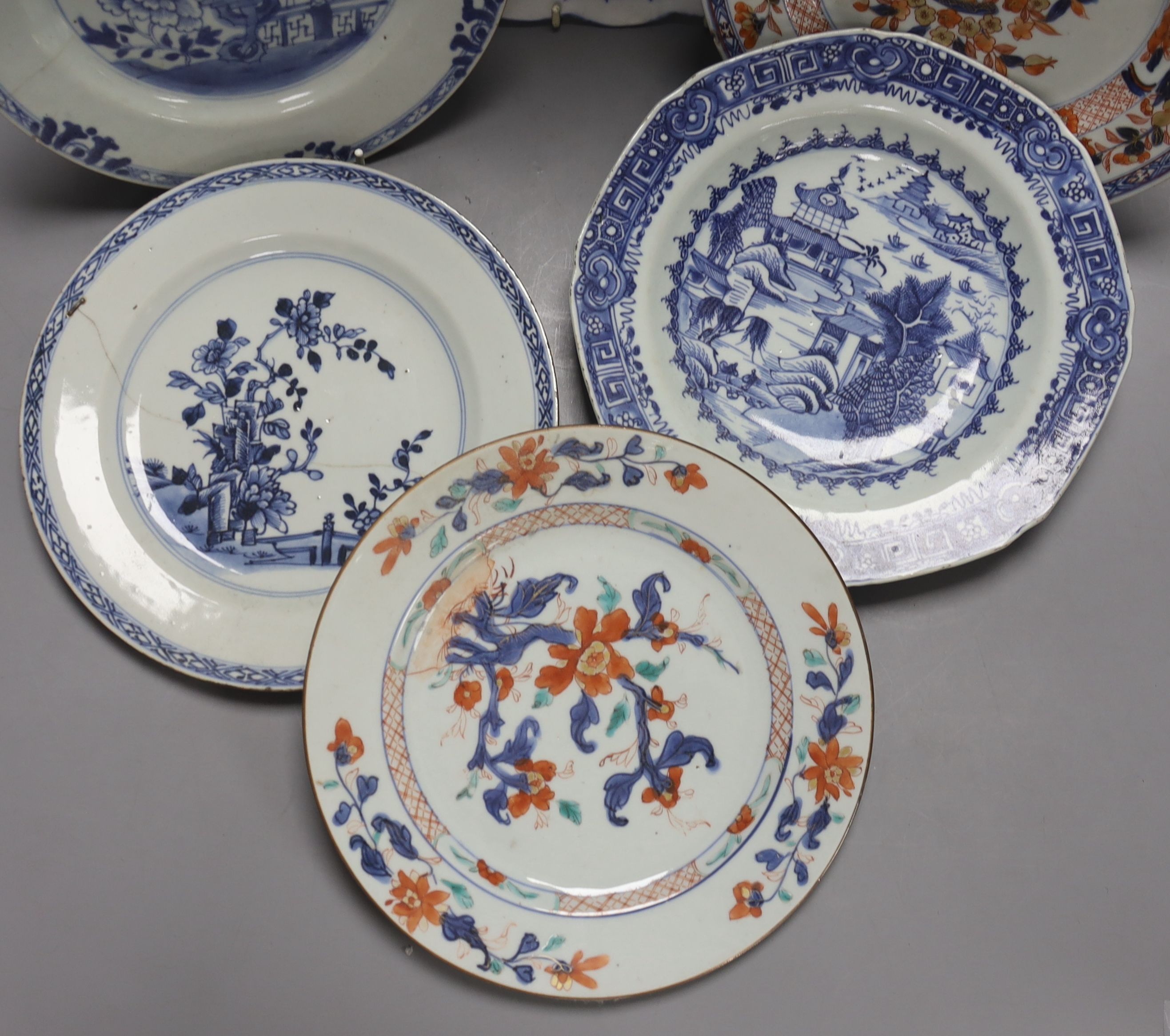 Two Chinese Imari dishes, three Chinese blue and white dishes, a larger Japanese blue and white dish, 5 Japanese blue and white saucer dishes and 2 miniature blue and white jardinieres. 40cm